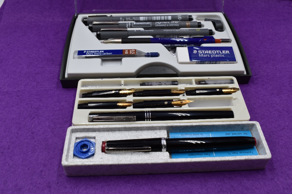 A selection of Staedler drawing pens and Osmiroid multi nib calligraphy pen