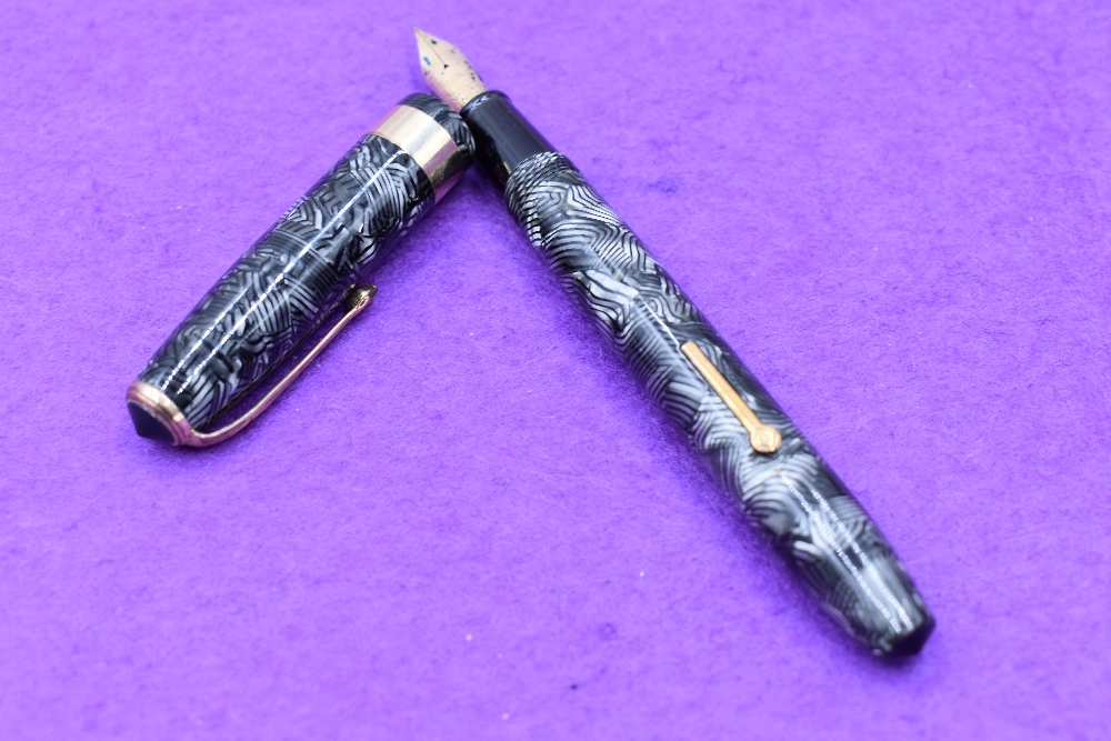 A Conway Stewart 27 fountain pens, lever fill in grey lined pattern, with single broad band to cap