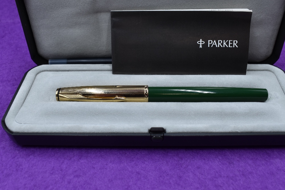 A boxed Parker Insignia fountain pen, jade green with gold cap