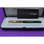 A boxed Parker Insignia fountain pen, jade green with gold cap