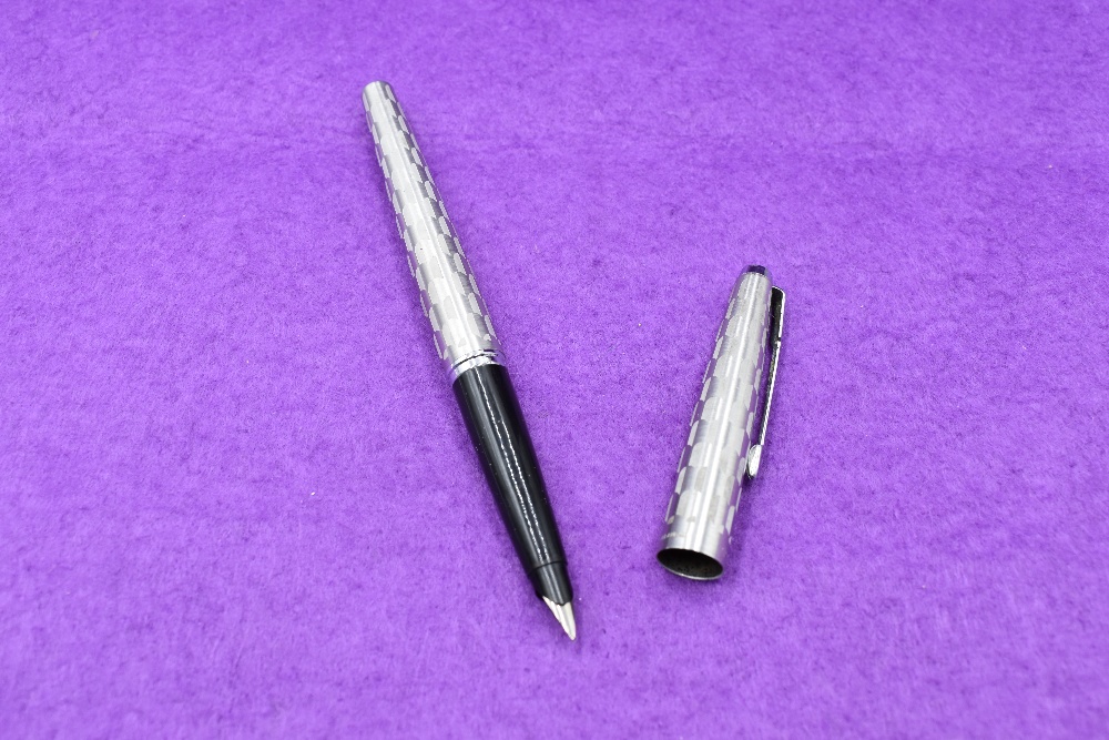A Parker 45 Harlequin Grey Shield pattern fountain pen