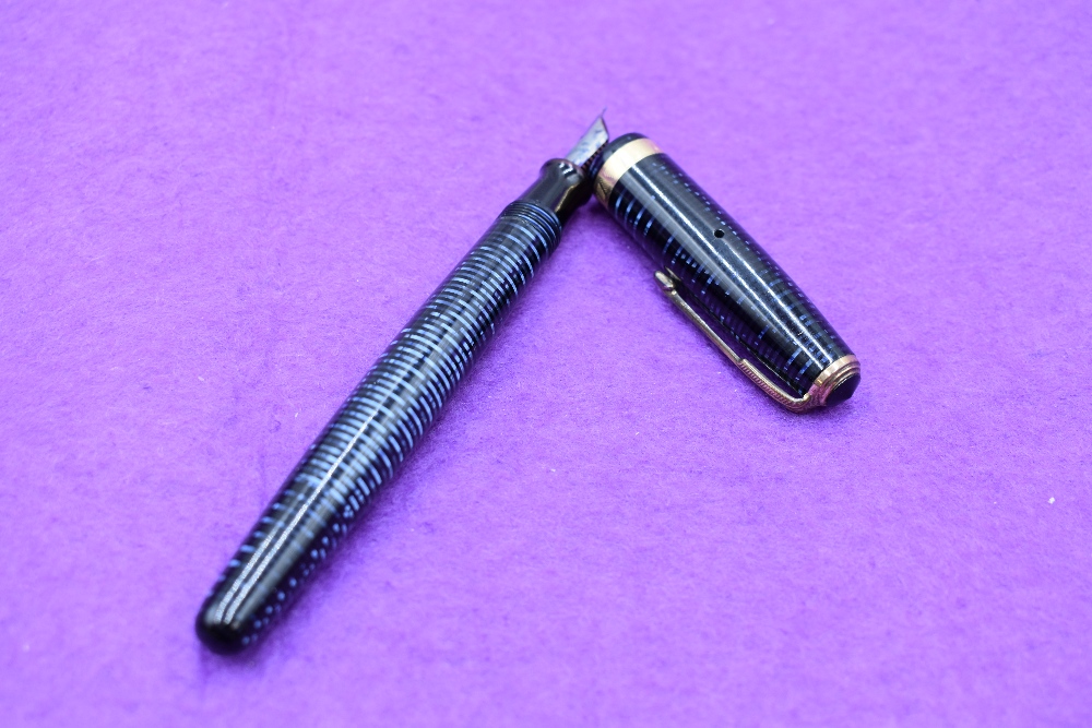 A Parker Vacumatic Blue Diamond in blue and black with single decorative band to cap