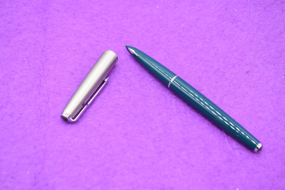 A Parker 61 in blue with a brushed metal cap