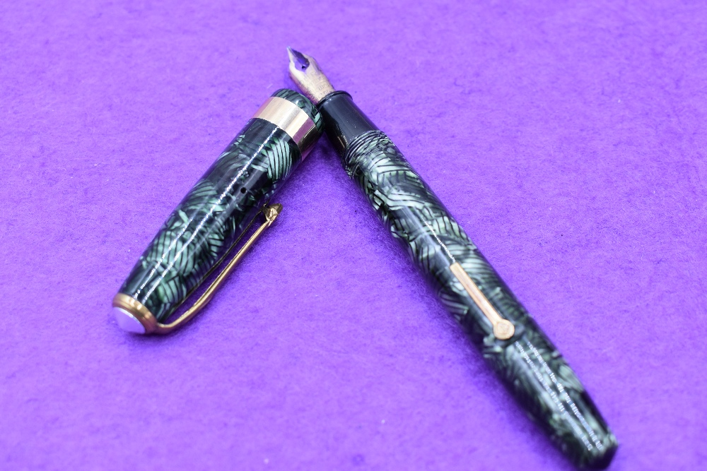 A Conway Stewart 60 fountain pen, lever fill in grey and black lined pattern, single broad band to