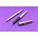 A Parker 45 Harlequin Grey Shield pattern fountain pen and ballpoint pen set