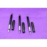 Three Parker Vector fountain pens in black