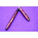 A Conway Stewart 85L fountain pen lever fill, in Rose with Gold Vein, single broad band to cap