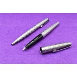 A Parker 45 Harlequin Grey Shield pattern fountain pen and ballpoint pen set