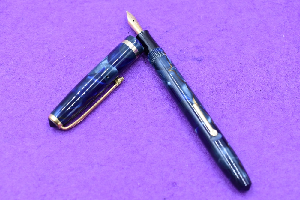 A Conway Stewart No12 fountain pen lever fill, in Blue Marble with gold veining, single band to cap