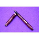 A Conway Stewart 85L fountain pen, lever fill in Red Herringbone, single broad band to cap