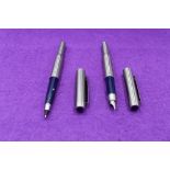 A Parker 25 Flighter fountain pen and rollerball pen in stainless steel