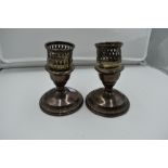 A pair of American silver candle sticks of squat form by La Pierre of New York having screw in