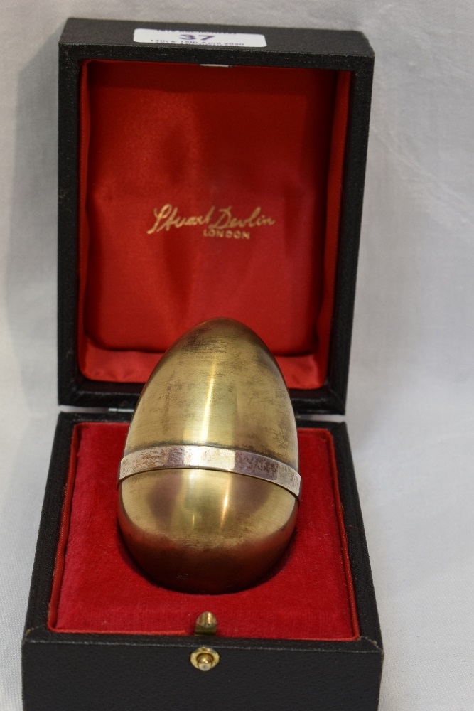 A cased Stuart Devlin 1975 silver gilt limited edition surprise Easter egg having a polished - Image 2 of 2