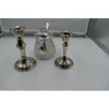 Two small HM silver candle sticks and a cut glass preserve pot having HM silver lid and spoon