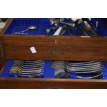 An oak canteen of cutlery in the Wellington chest style, by W Batty & Sons, Manchester &