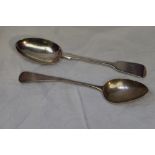 A Georgian silver table spoon of Old English form bearing monogram to terminal, London 1813,