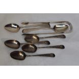 A selection of Georgian silver including teaspoons and a pair of sugar nips of plain form