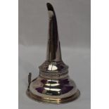 A George III silver two piece wine funnel having pierced strainer and reeded decoration to rim,
