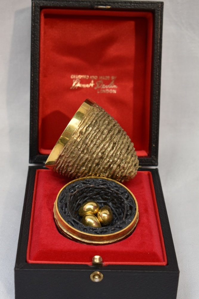 A cased Stuart Devlin 1971 silver gilt surprise Easter egg having a textured exterior opening to - Image 2 of 2