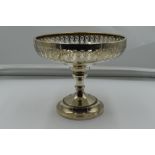 A silver tazza having pierced decoration and pedestal foot, Birmingham 1914, makers marks worn,
