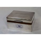 A silver cigarette box of plain form bearing presentation inscription to lid, Sheffield 1950, Walker