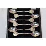 A set of six HM silver teaspoons having moulded golf scenes to terminals, various Birmingham