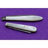 A Victorian folding fruit knife having a silver blade with engraved grape vine decoration and a