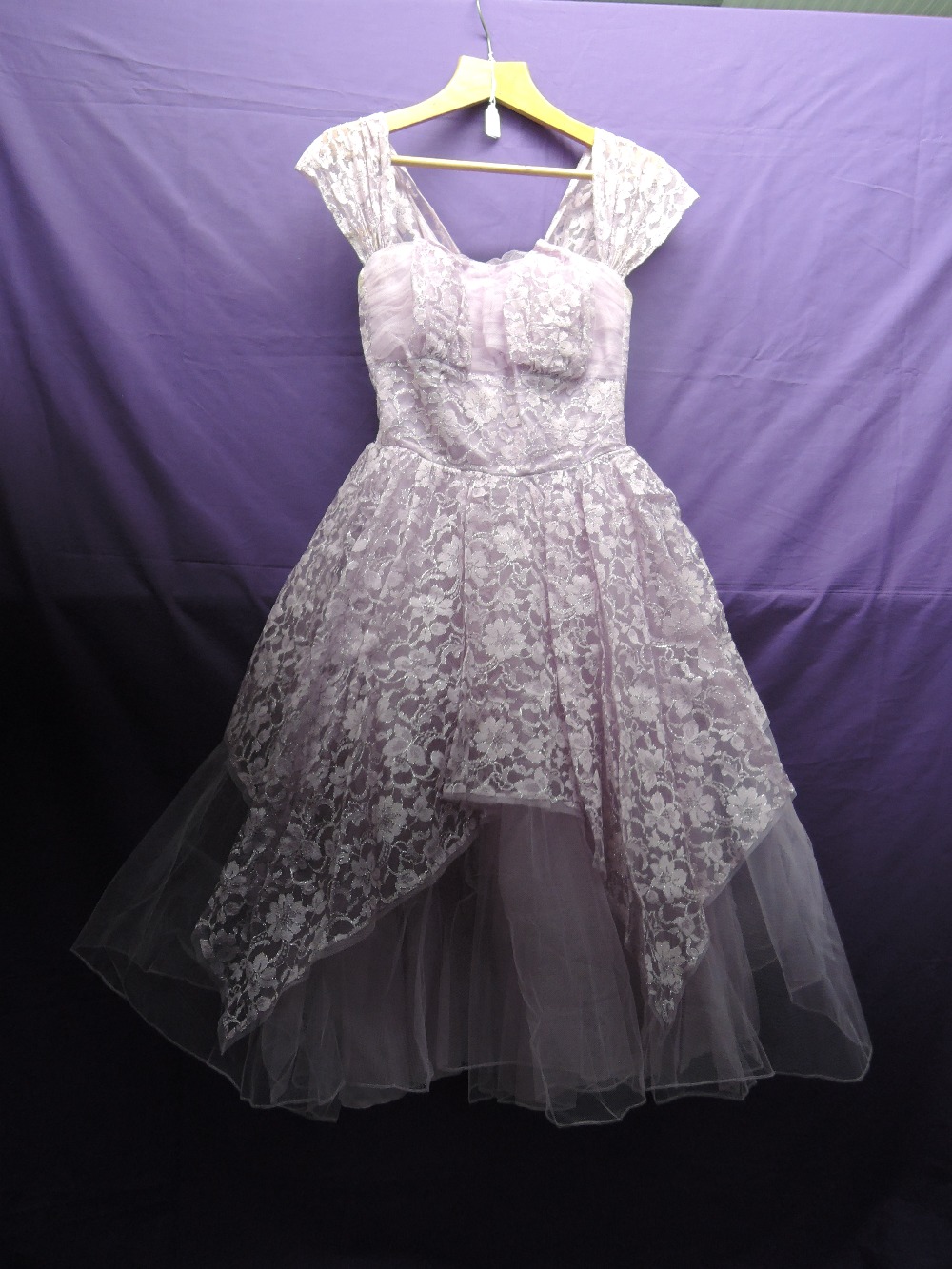 Vintage 1950s lilac and silver gown having layers of tulle over an integrated underskirt. Back metal