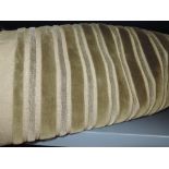 A large piece of vintage olive green upholstery fabric having raised velvet ribbed pattern.