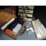 A huge variety of vintage costume jewellery in a small case and little sets of drawer