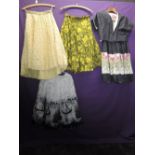 Three patterned cotton 1950s skirts and a cotton dress and bolero having rose print.good