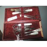 A Late 19th century manicure set containing scissors , button hooks and similar, five items having