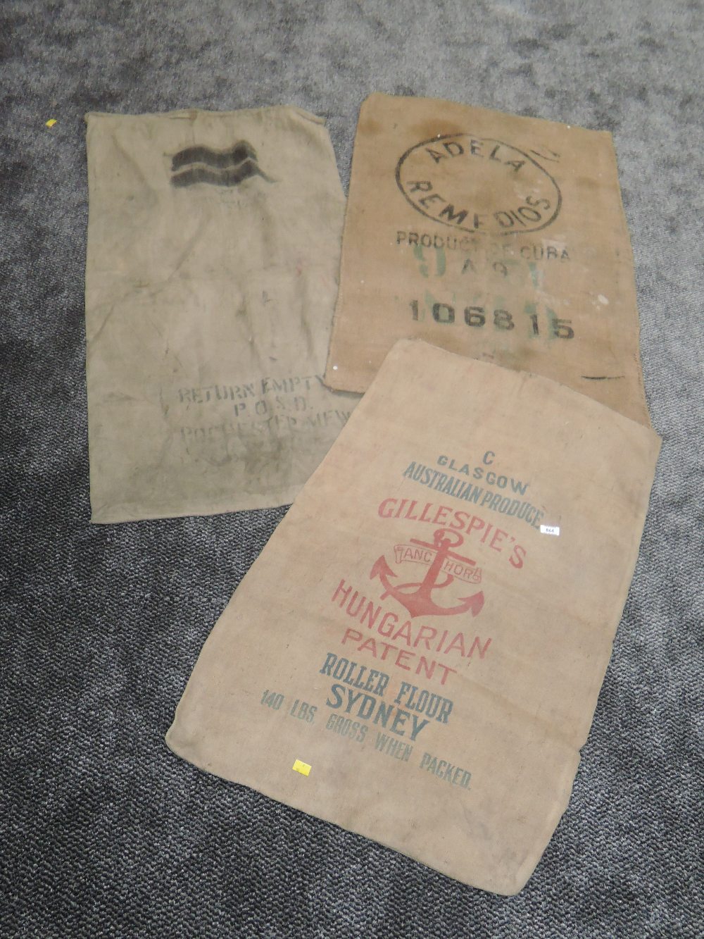 Three vintage advertising sacks. One postal and the other two flour or similar.