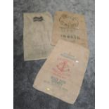 Three vintage advertising sacks. One postal and the other two flour or similar.