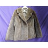 A beautiful short lighter brown mink jacket , around 1960s, Brilliant condition.