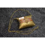 An ornate vintage brass and copper embossed evening bag or similar.having clasp fastening to front