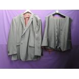 An unworn gents grey suit by Jacamo, size uk 60