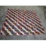 A large log cabin design quilt around mid to late 1800s, using vibrant silks,velvets and cottons,