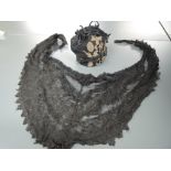 A small victorian silk draw string bag having gold thread embroidery, and a black lace shawl.