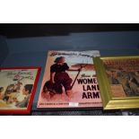 A small collection of reproduction advertising pictures in frames and enamel sign, including land