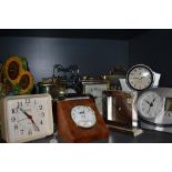 A selection of battery operated clocks, including digital display and classic carriage clock