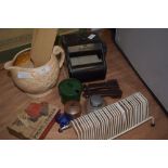 An assortment of vintage odds and ends including various bakelite items, a set of carpet grips, a