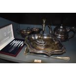 A selection of plated metal wares including graduated trays and part L R S tea set