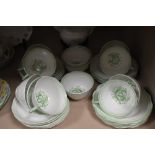 A Royal Albert part tea service in mint green having abstract floral pattern.