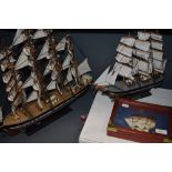 Three modern wooden sailing models, Wendur, Cutty Sark and Discovery along with a similar wall