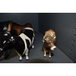 A selection of figures and figurines including Beswick cow and horse one AF