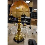 A vintage brass and wood table lamp.