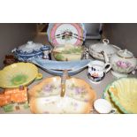 An assorment of vintage ceramics including platters and bowls, jugs,plates, tureens and similar,