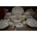 A Royal Doulton part tea service 'Gold concord', includes coffee pot,tureens, bowls, plates, cups