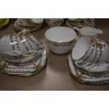 A mid century part tea service having deco hand painted detailing to transfer